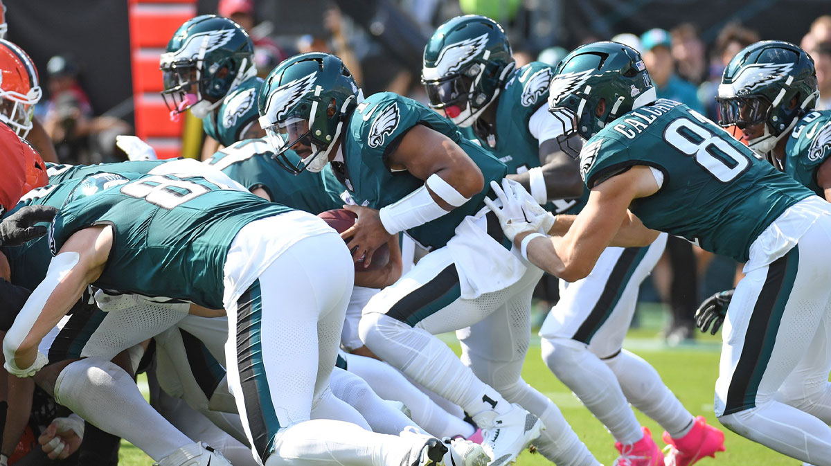 Philadelphia Eagles quarterback Jalen Hurts (1) picks up a first down against the Cleveland Browns during the first quarter at Lincoln Financial Field.