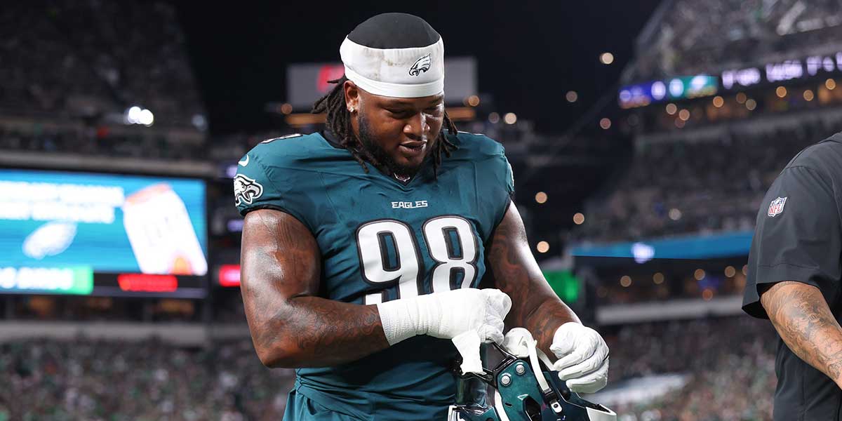 Eagles defensive tackle Jalen Carter (98) walks off the field after being ejected during the first quarter of the game against the Dallas Cowboys at Lincoln Financial Field