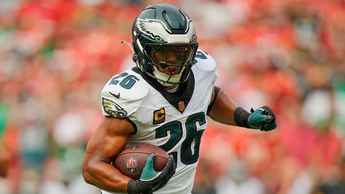 Philadelphia Eagles running back Saquon Barkley (26) carries the ball for a touchdown against the Kansas City Chiefs during the first quarter of the game at GEHA Field at Arrowhead Stadium.