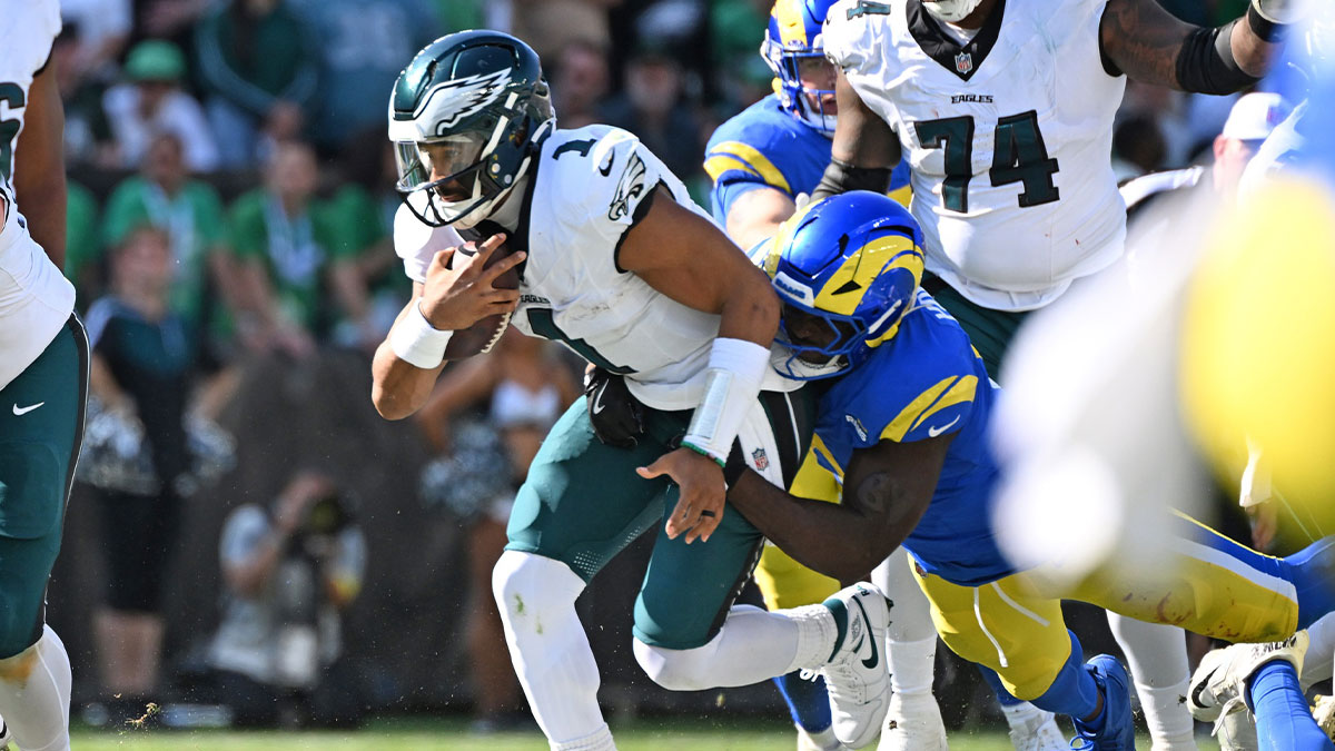 Philadelphia Eagles quarterback Jalen Hurts (1) is sacked by Los Angeles Rams linebacker Byron Young (0) during the fourth quarter at Lincoln Financial Field.