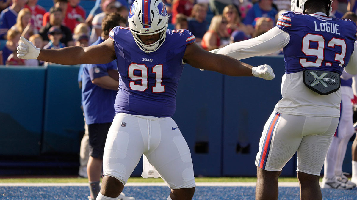 Buffalo Bills defensive tackle Ed Oliver and defensive tackle Zion Logue dance to the music for a few moments while waiting for their turn to run a drill during the Return of the Blue & Red practice at Highmark Stadium in Orchard Park on Aug.1, 2025.