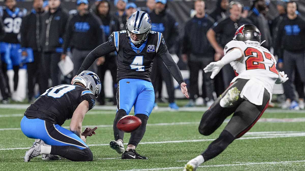 Carolina Panthers place kicker Eddy Pineiro (4) kicks a field goal against the Tampa Bay Buccaneers during the second quarter at Bank of America Stadium.