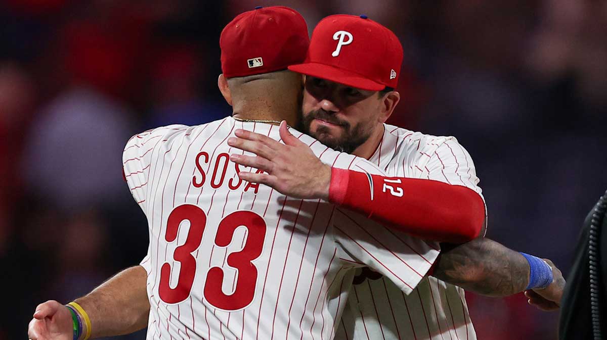 Philadelphia Phillies short stop Edmundo Sosa (33) and outfielder Kyle Schwarber (12) celebrate a victory against the Miami Marlins at Citizens Bank Park.