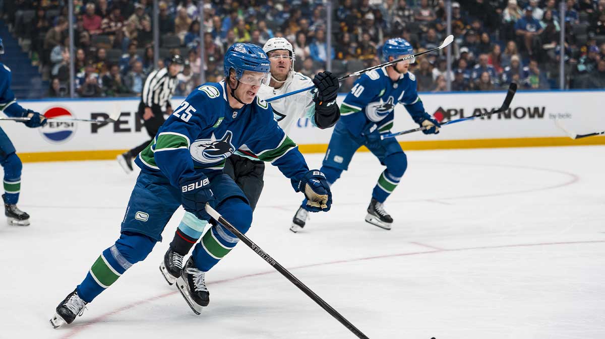 Vancouver Canucks defenseman Elias Pettersson (25) skates after the loose puck against the Seattle Kraken in the second period at Rogers Arena.