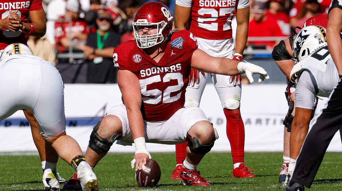 Oklahoma Sooners offensive lineman Troy Everett (52) calls out signals during the first quarter against the Navy Midshipmen at Amon G. Carter Stadium.