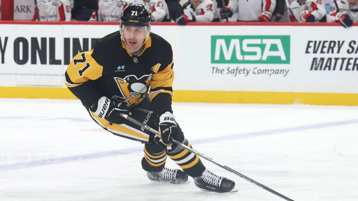 Pittsburgh Penguins center Evgeni Malkin (71) skates with the puck against the Washington Capitals during the second period at PPG Paints Arena.