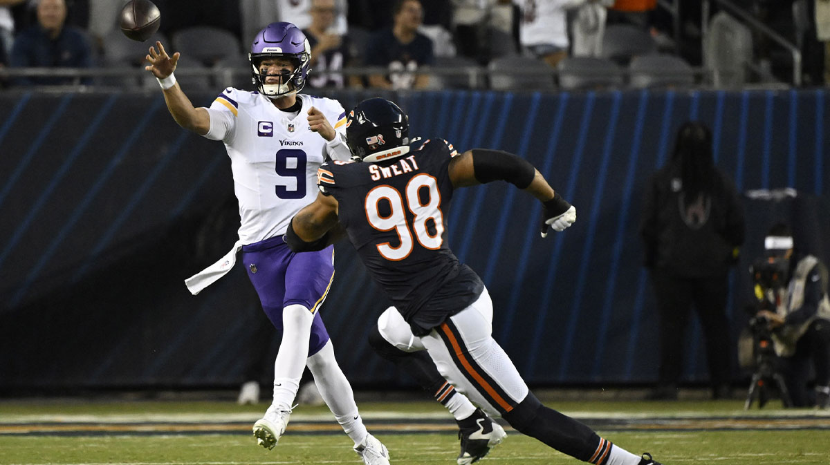 Minnesota Vikings quarterback J.J. McCarthy (9) drops back to pass against the Chicago Bears during the first half at Soldier Field.