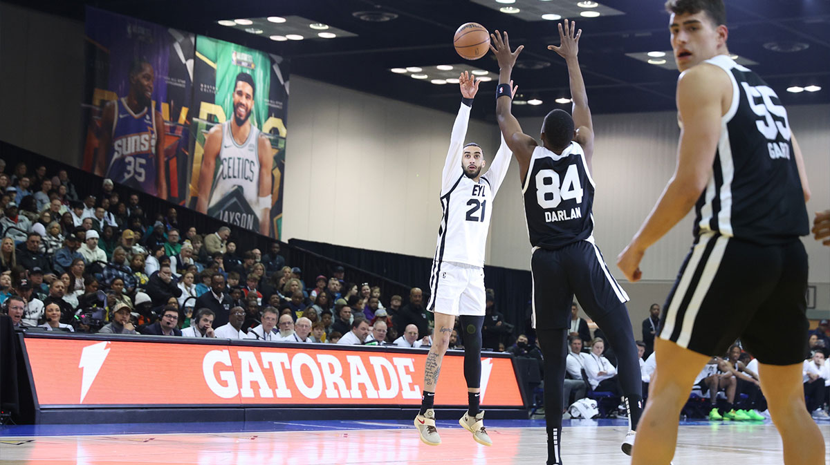 Feb 18, 2024; Indianapolis, Indiana, USA; Team ELY guard Trevelin Queen (21) of the Osceola Magic shoots the ball over Team Stricly guard Thierry Darlan (84) of the G League Ignite during the G-League Next Up game at Indiana Convention Center. Mandatory Credit: Trevor Ruszkowski-Imagn Images