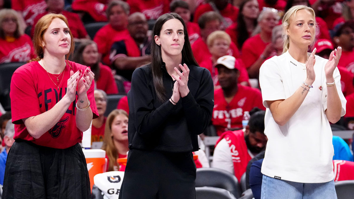 Indiana Fever forward Chloe Bibby (55), guard Caitlin Clark (22) and guard Sophie Cunningham (8) cheer during Game 4 of the WNBA semifinals on Sunday, Sept. 28, 2025, at Gainbridge Fieldhouse in Indianapolis. The Fever defeated the Aces 90-83.