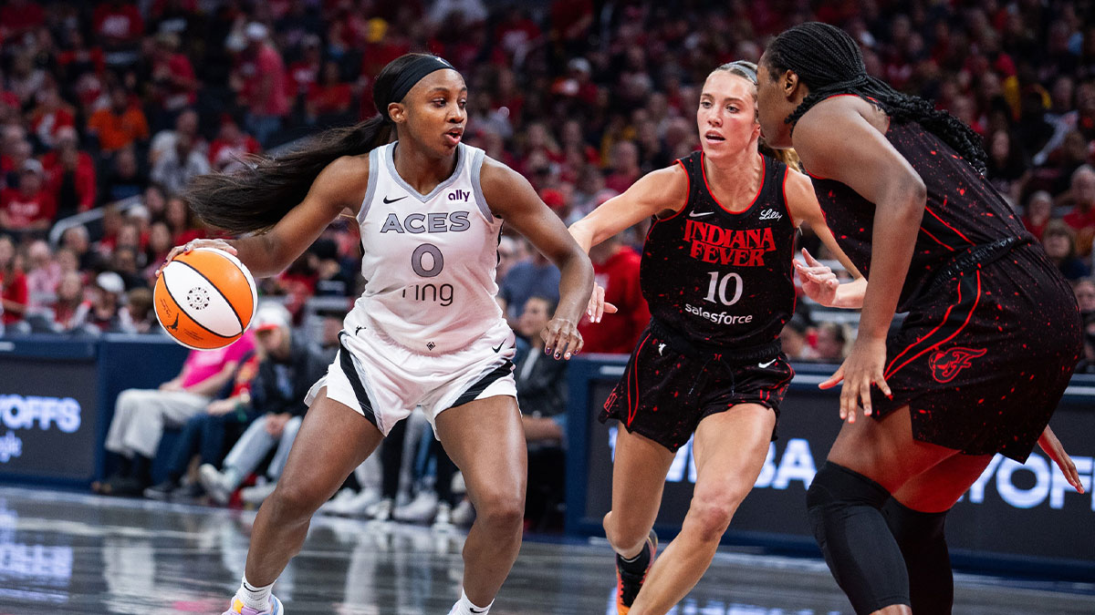 Las Vegas Aces guard Jackie Young (0) dribbles the ball while Indiana Fever guard Lexie Hull (10) defends during game three of the second round for the 2025 WNBA Playoffs at Gainbridge Fieldhouse.