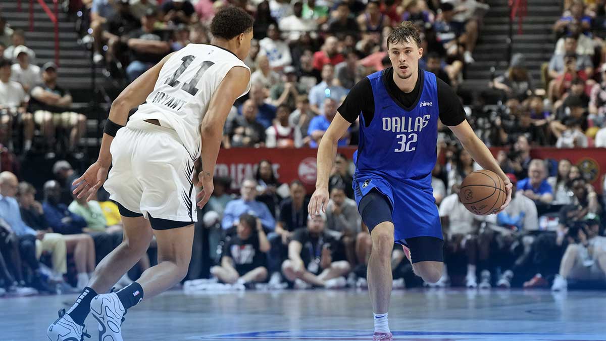 Dallas Mavericks forward Cooper Flagg (32) dribbles against San Antonio Spurs forward Carter Bryant (11) in the fourth quarter of their game at Thomas & Mack Center.