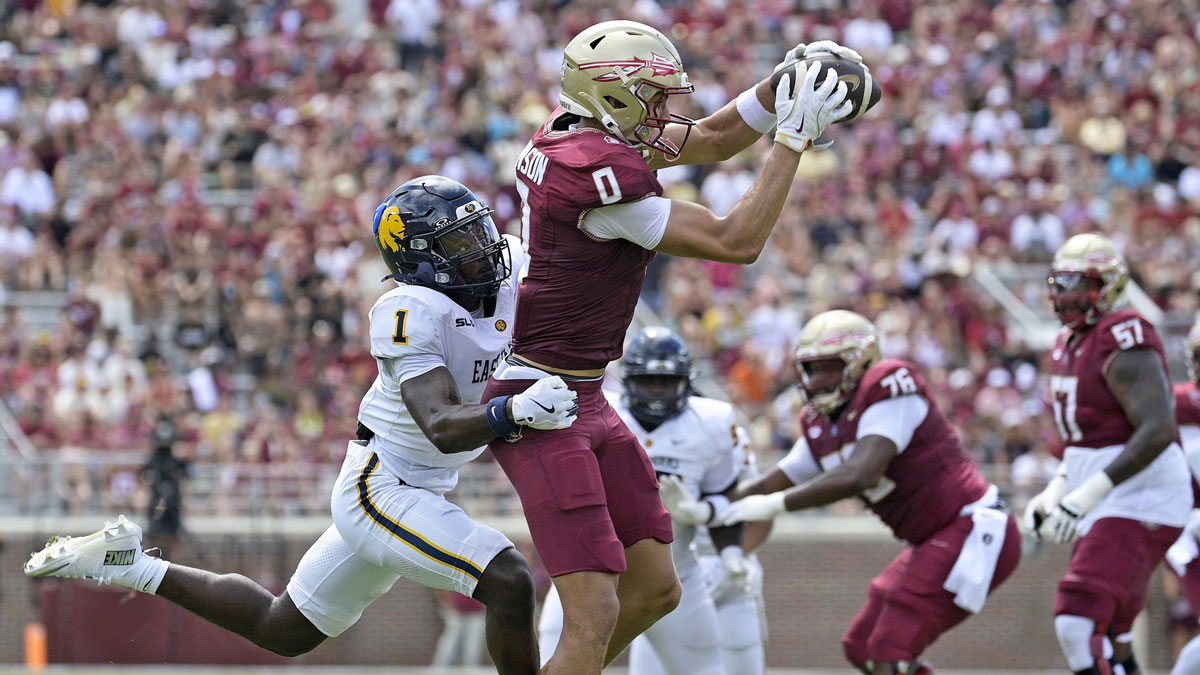 Florida State Seminoles wide receiver Duce Robinson (0) catches a pass over East Texas A&M Lions cornerback Kaleb Miles (1) during the first half at Doak S. Campbell Stadium.