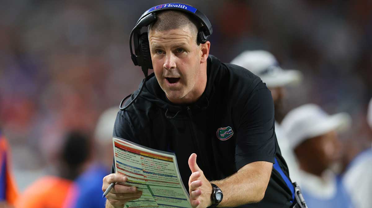 Florida Gators head coach Billy Napier call for a timeout against the Miami Hurricanes during the fourth quarter at Hard Rock Stadium.