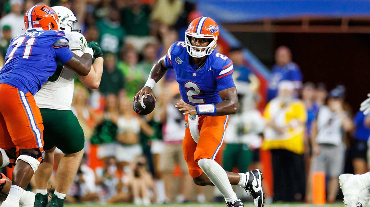 Florida Gators quarterback DJ Lagway (2) scrambles with the ball against the Florida Gators during the second half at Ben Hill Griffin Stadium.