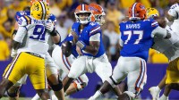 Florida Gators quarterback DJ Lagway (2) against LSU Tigers defensive tackle Walter Mathis Jr. (91) during the second half at Tiger Stadium.
