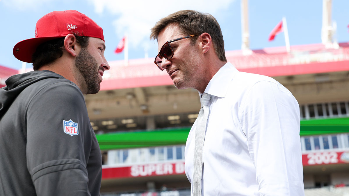 Tampa Bay Buccaneers quarterback Baker Mayfield (6), left, speaks with Tom Brady before the game against the Philadelphia Eagles at Raymond James Stadium.
