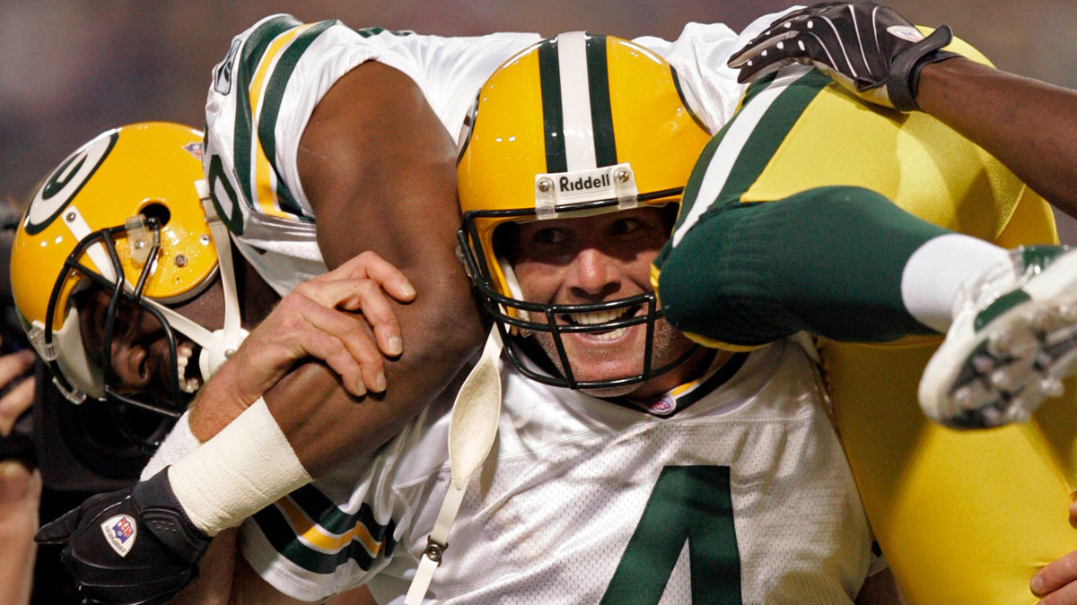After breaking the NFL record for career touchdown passes, Green Bay Packers quarterback Brett Favre hoists its recipient, Greg Jennings, during the first quarter of their game against the Minnesota Vikings Sunday, September 30, 2007 at the Metrodome in Minneapolis, Minn. Favre's 421st touchdown pass eclipsed Dan Marino's record.