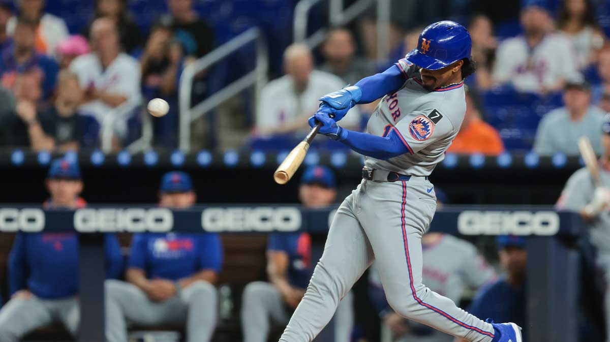 New York Mets shortstop Francisco Lindor (12) hits a home run against the Miami Marlins during the first inning at loanDepot Park.