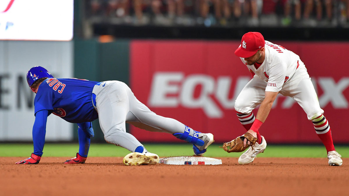 Chicago Cubs outfielder Pete Crow-Armstrong (4) is safe at second base as St. Louis Cardinals second baseman Garrett Hampson (13) was late putting the tag on him at Busch Stadium.