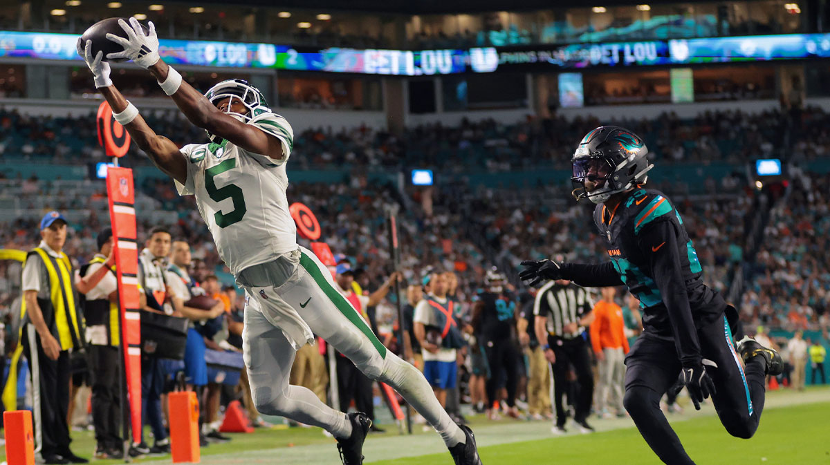 New York Jets wide receiver Garrett Wilson (5) attempts to make a catch against Miami Dolphins cornerback Artie Burns (23) during the second half at Hard Rock Stadium.