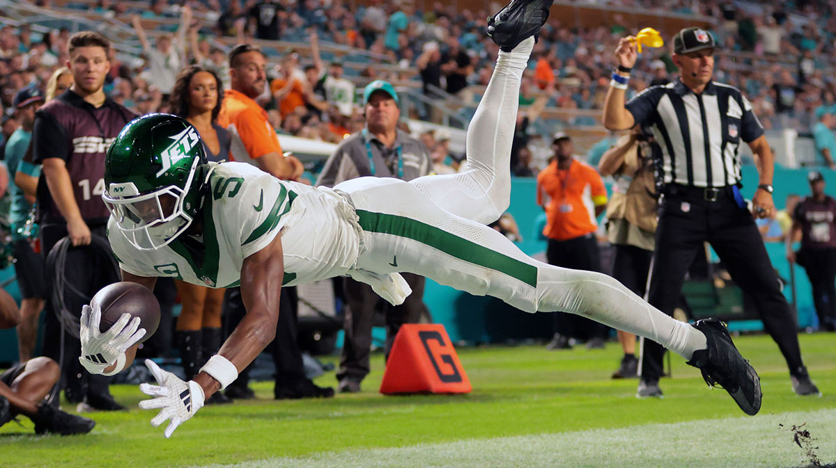 New York Jets wide receiver Garrett Wilson (5) attempts to make a catch against Miami Dolphins cornerback Artie Burns (not pictured) during the second half at Hard Rock Stadium.
