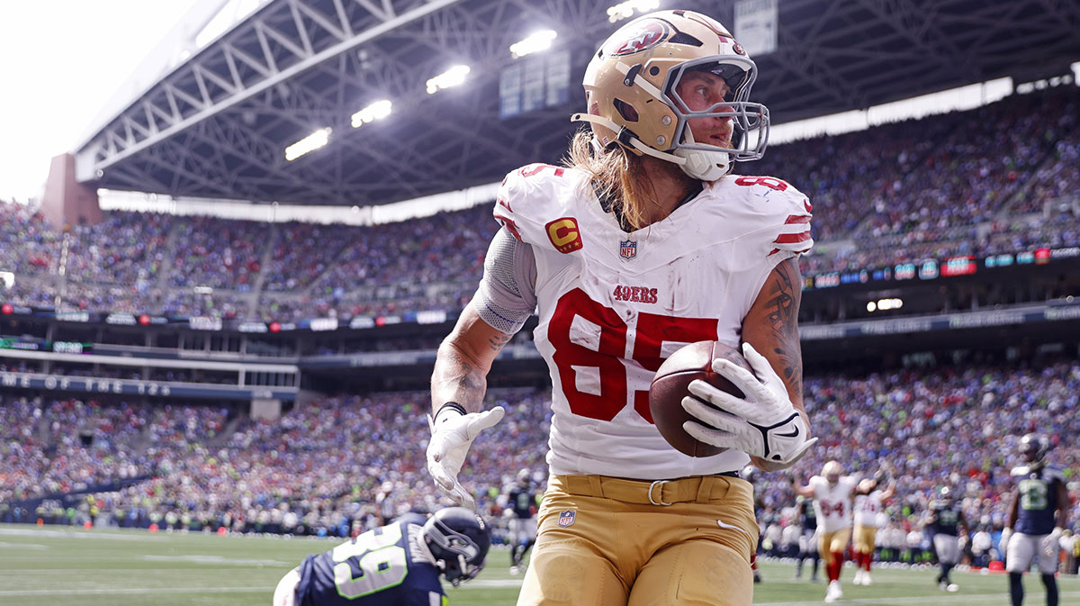 San Francisco 49ers tight end George Kittle (85) celebrates after scoring a touchdown during the first half against the Seattle Seahawks during the first quarter at Lumen Field.