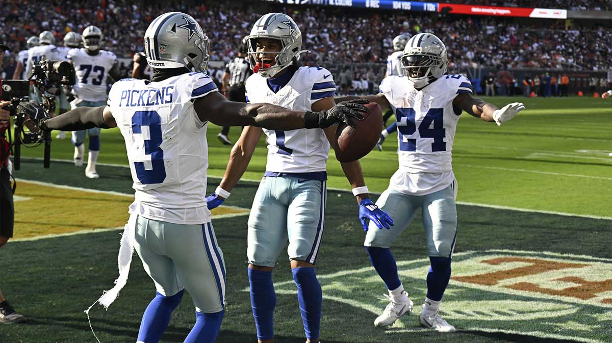 Dallas Cowboys wide receiver George Pickens (3) reacts after scoring a touchdown against the Chicago Bears during the first half at Soldier Field.