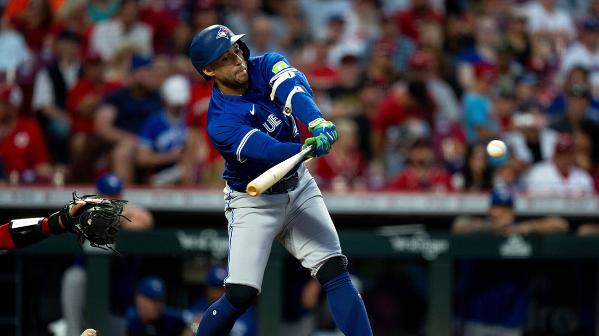 Toronto Blue Jays designated hitter George Springer (4) hits a base hit in the fifth inning between the Cincinnati Reds and Toronto Blue Jays at Great American Ball Park in Cincinnati on Sept. 3, 2025.