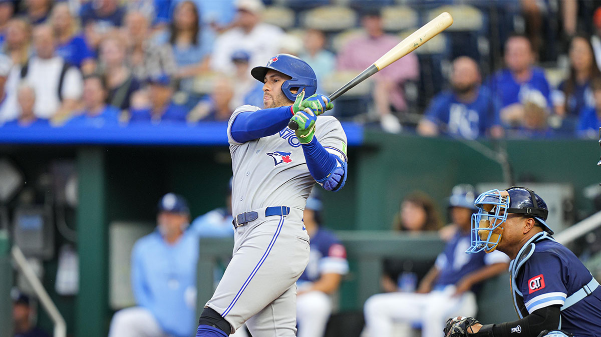 Toronto Blue Jays designated hitter George Springer (4) hits a home run during the first inning against the Kansas City Royals at Kauffman Stadium.