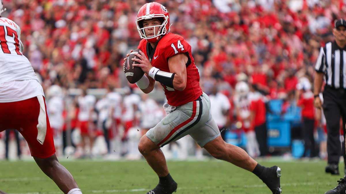 Georgia Bulldogs quarterback Gunner Stockton (14) looks to throw against the Austin Peay Governors in the second quarter at Sanford Stadium.