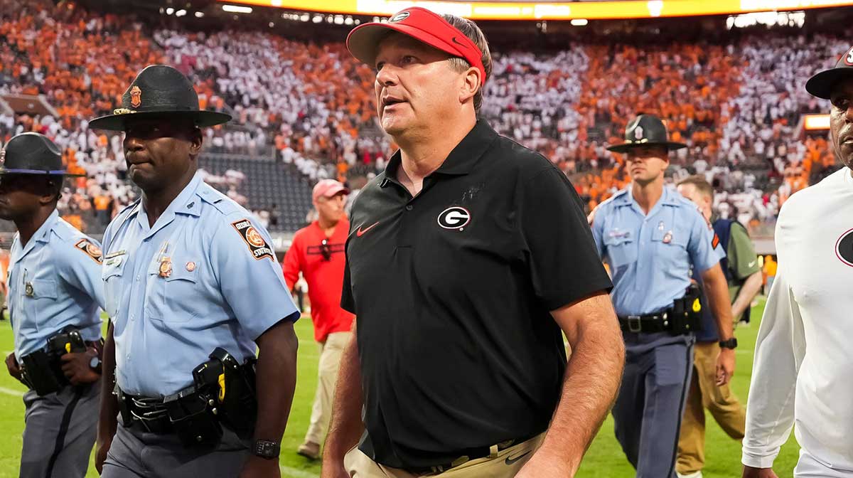 Georgia head coach Kirby Smart walks off the field after an overtime win against Tennessee.