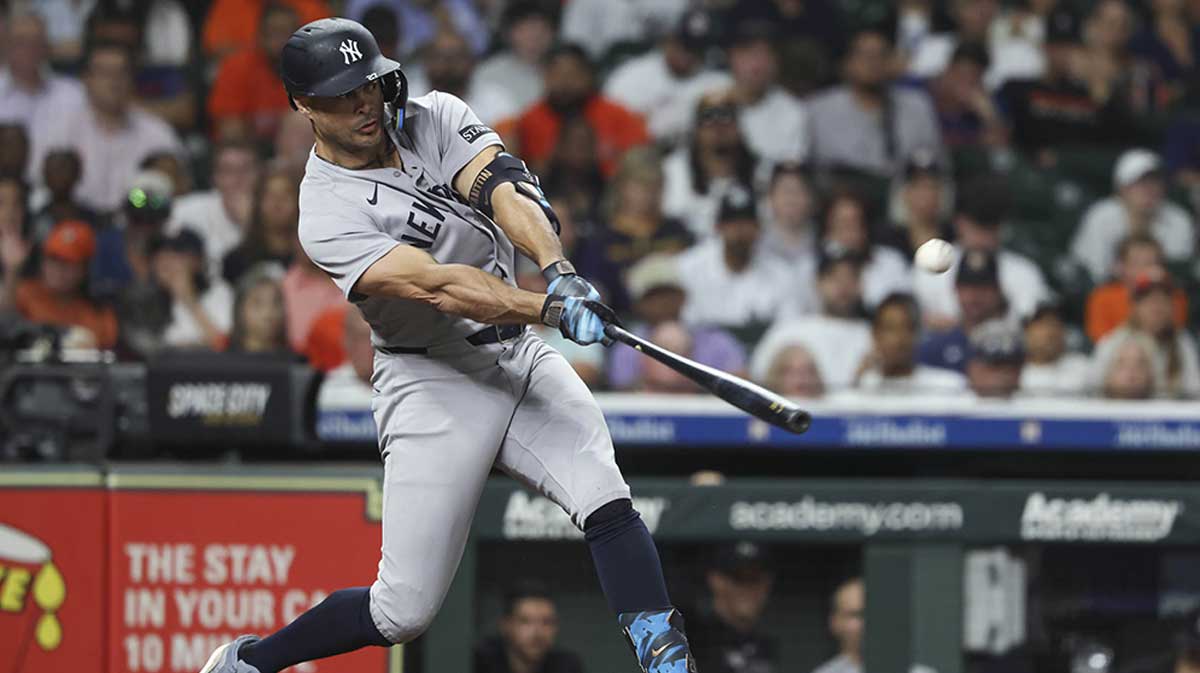 New York Yankees left fielder Giancarlo Stanton (27) bats during the seventh inning against the Houston Astros at Daikin Park.