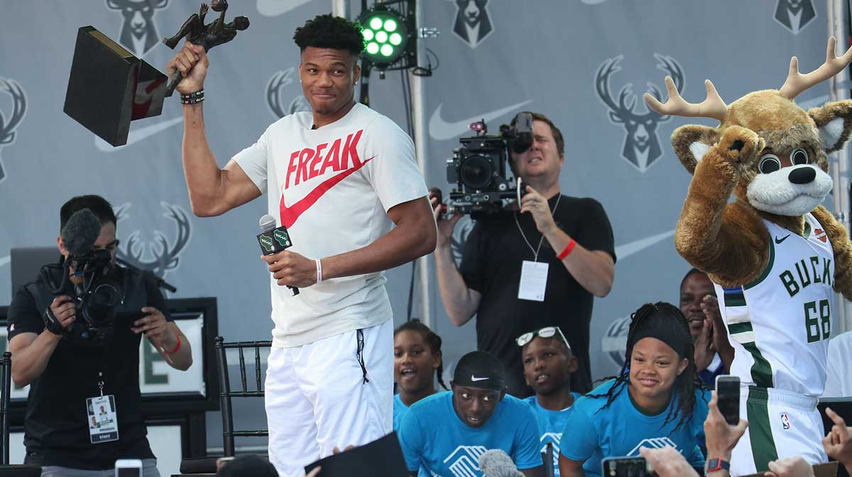 Giannis Antetokounmpo celebrates his MVP award with Bucks fans.