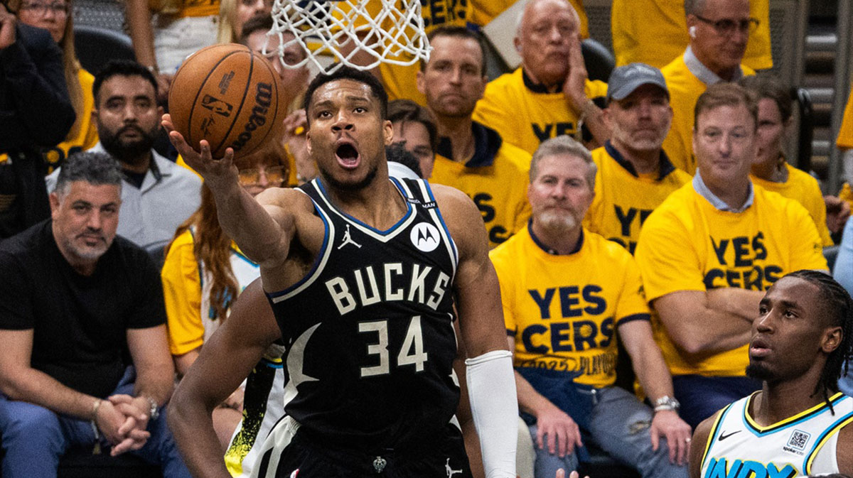 Milwaukee Bucks forward Giannis Antetokounmpo (34) shoots the ball while Indiana Pacers guard Andrew Nembhard (2) defends during game five of the first round for the 2024 NBA Playoffs at Gainbridge Fieldhouse.