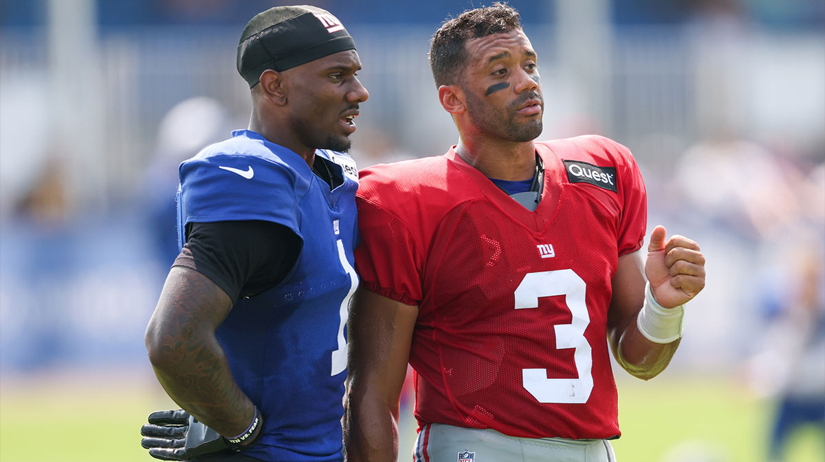 New York Giants wide receiver Malik Nabers (1) talks with quarterback Russell Wilson (3) during training camp at Quest Diagnostics Training Center.