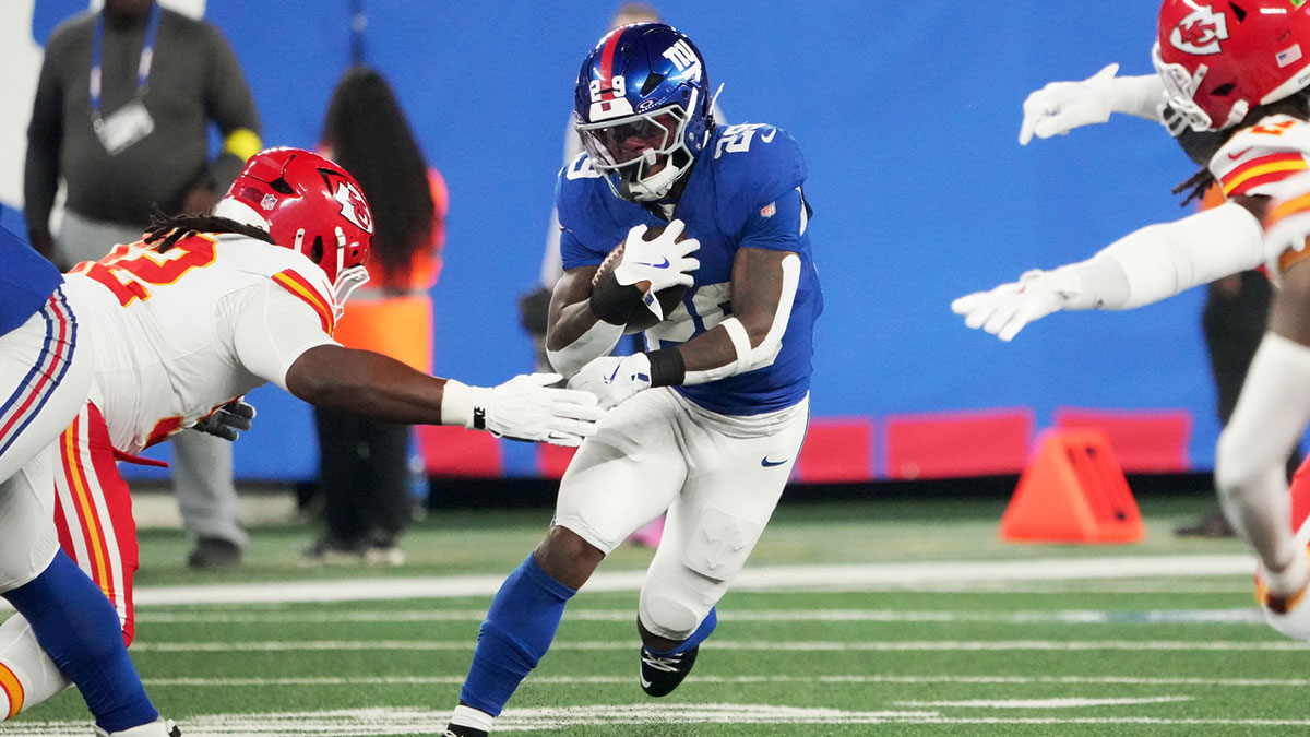 New York Giants running back Tyrone Tracy Jr. (29) runs against Kansas City Chiefs linebacker Nick Bolton (32) in the first quarter at MetLife Stadium.