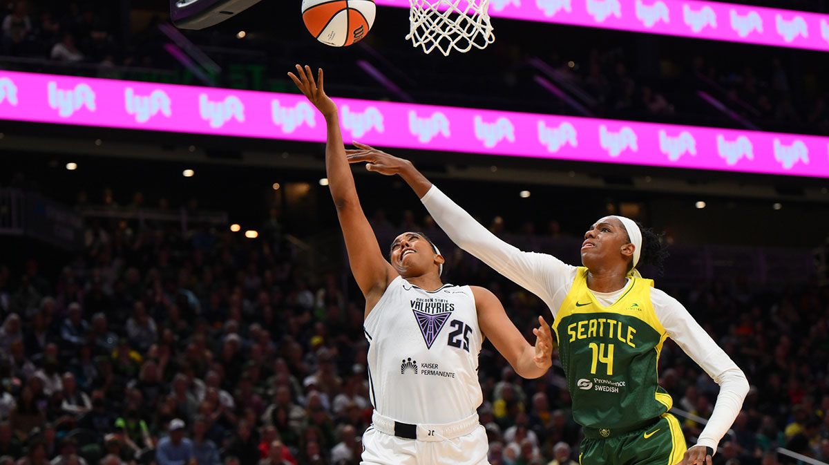 Golden State Valkyries forward Monique Billings (25) shoots a layup while defended by Seattle Storm center Dominique Malonga (14) during the second half at Climate Pledge Arena