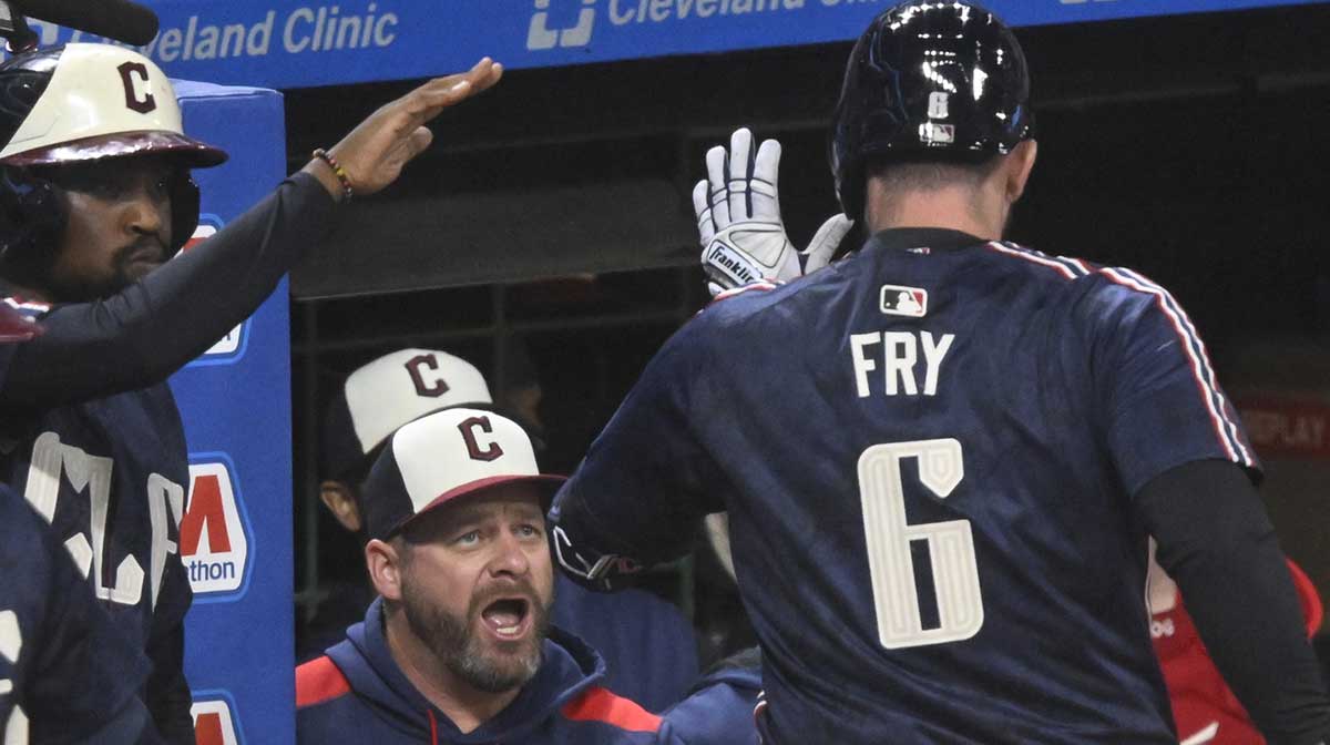 Cleveland Guardians designated hitter David Fry (6) celebrates his solo home run with manager Stephen Vogt (12) in the fourth inning against the Chicago White Sox at Progressive Field.