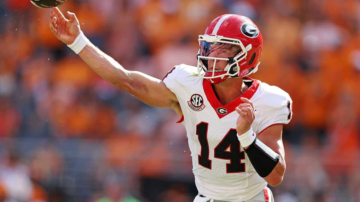 Georgia Bulldogs quarterback Gunner Stockton (14) throws a pass during the second half against the Tennessee Volunteers at Neyland Stadium.