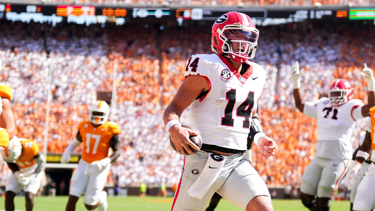 Georgia quarterback Gunner Stockton (14) runs into the end zone for a touchdown during a college football game between Tennessee and Georgia at Neyland Stadium in Knoxville, Tenn., on Sept. 13, 2025.