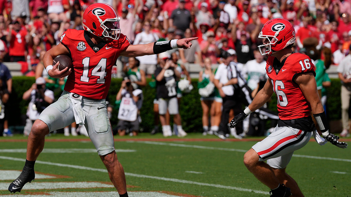 Georgia quarterback Gunner Stockton (14) celebrates with Georgia wide receiver London Humphreys (16) while walking in for a touchdown during the first half of a NCAA college football game against Marshall