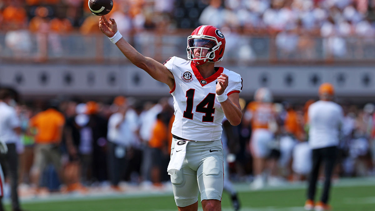Georgia Bulldogs quarterback Gunner Stockton (14) warms up before the game against the Tennessee Volunteers at Neyland Stadium.