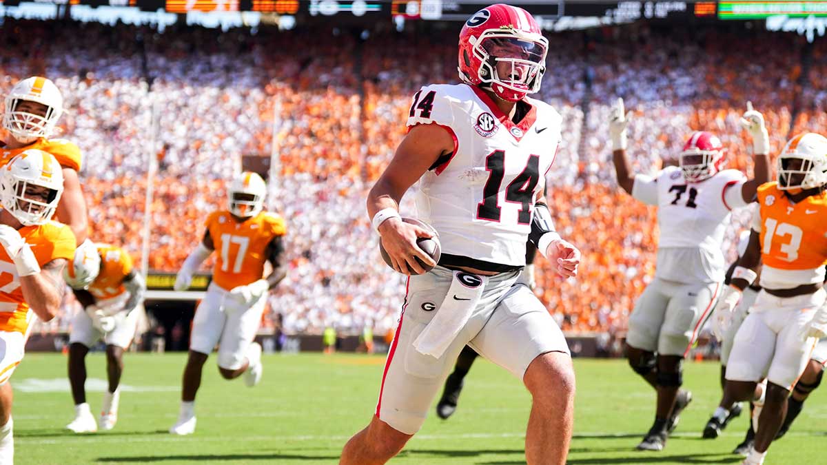 Georgia quarterback Gunner Stockton (14) runs into the end zone for a touchdown during a college football game between Tennessee and Georgia at Neyland Stadium