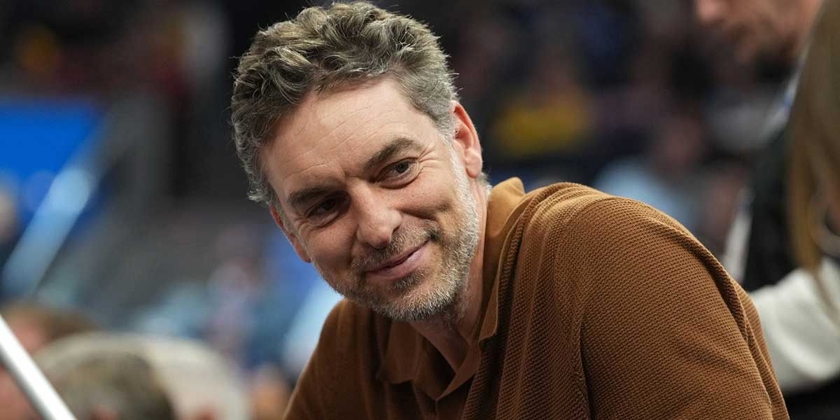 Lakers former center Pau Gasol sits in the crowd during the second quarter against the Golden State Warriors at Chase Center with Timberwolves All-Star Anthony Edwards in the background