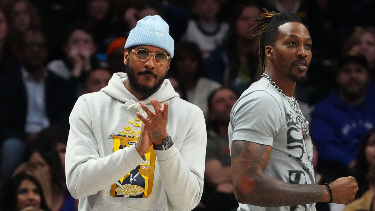 Carmelo Anthony (7) (left) and center Dwight Howard (39) (right) cheer during the second half against the Denver Nuggets at Ball Arena