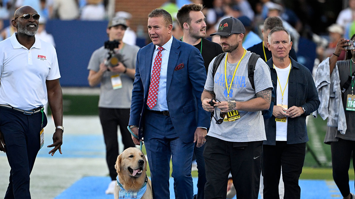 Kirk Herbstreit with his dog before the game at Kenan Stadium