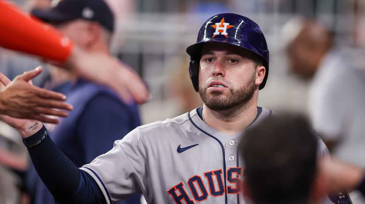Houston Astros catcher Victor Caratini (17) celebrates with teammates after scoring a run against the Atlanta Braves in the fifth inning at Truist Park.