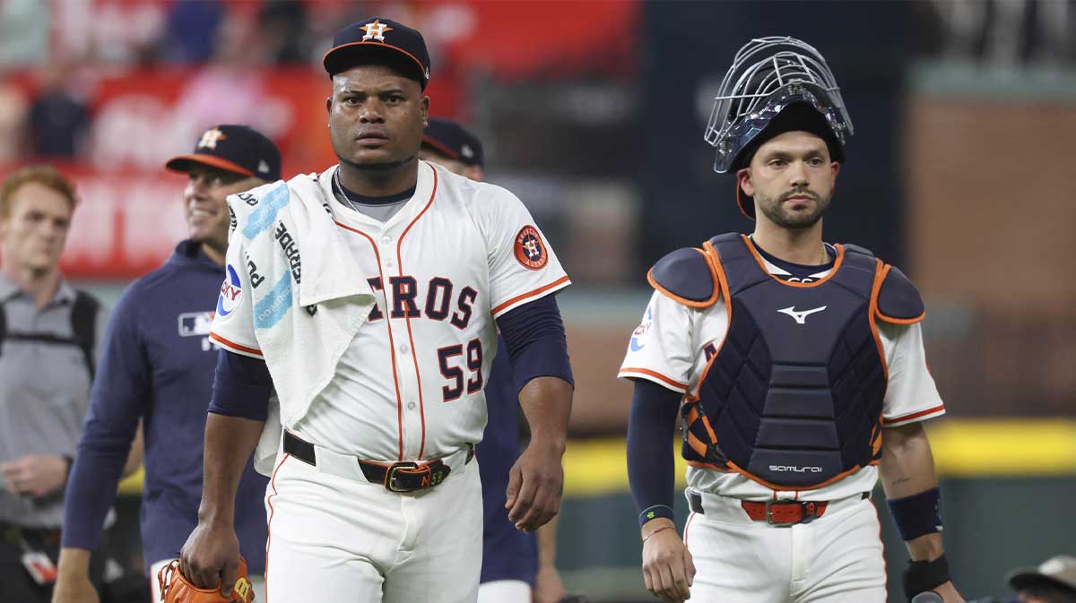 Houston Astros starting pitcher Framber Valdez (59) and catcher Cesar Salazar (18) walk to the dugout before the game against the New York Yankees at Daikin Park.