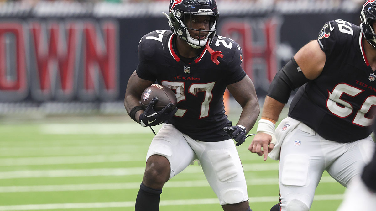 Houston Texans running back Woody Marks (27) runs with the ball during the fourth quarter against the Tennessee Titans