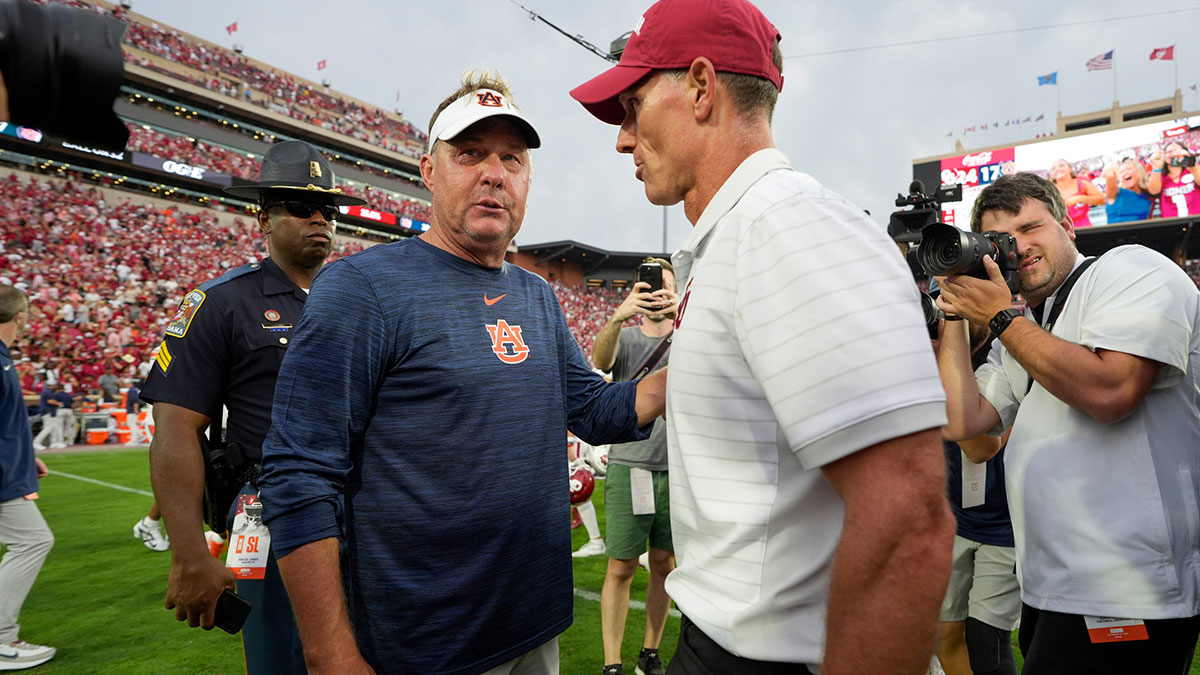 Auburn coach Hugh Freeze and Oklahoma coach Brent Venables talk after a college football game between the University of Oklahoma Sooners (OU) and the Auburn Tigers at Gaylord Family Ð Oklahoma Memorial Stadium in Norman, Okla., Saturday,Sept. 20, 2025.